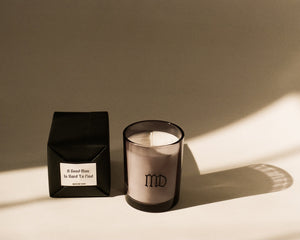 Minimalist smoke grey candle with wrapped black box packaging
